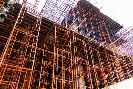 Concrete formwork and scaffolding on a construction site. Horizontally framed shot.の写真素材