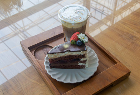 chocolate cake and white cream in the coffee cafe shopの写真素材