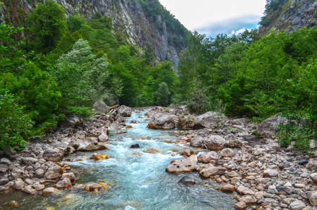 Fast and cold mountain river Gega in the Abkhaz gorge