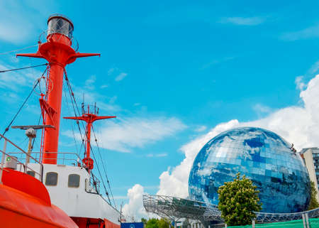 Kaliningrad, Russia. 1 June - 2021. The building of the Museum of the World Ocean in the form of a globe and a ship in the foregroundのeditorial素材
