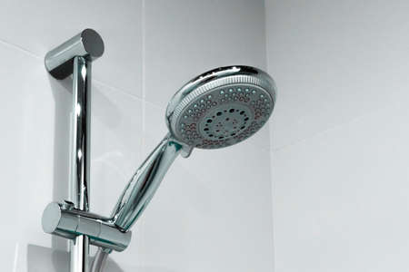 Shower head with water drops close up in the bathroomの写真素材