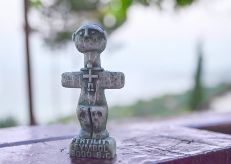 Idol of Pomos, ancient symbol of fertility on Cyprus. A small sculpture on a blurred background....