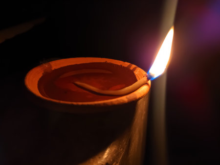 Glowing clay lamp and candle Happy diwali festive seasonÂ indian festival of dipawaliの写真素材