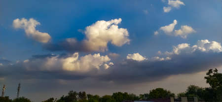 Sky blue white clouds tree image in india background wallpaper sky wallpaperの写真素材