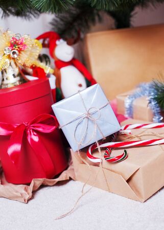 Christmas gifts lie under the Christmas treeの写真素材