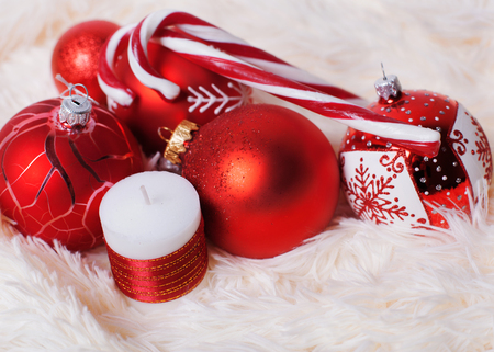 Christmas red balls on the fur backgroundの写真素材