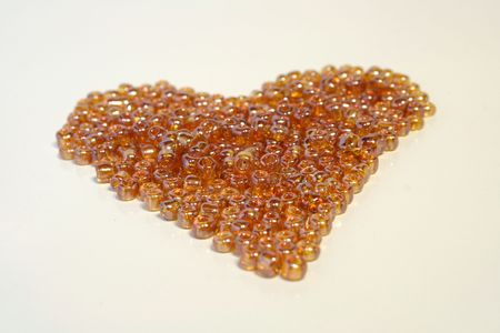 golden beads laying togetherの写真素材