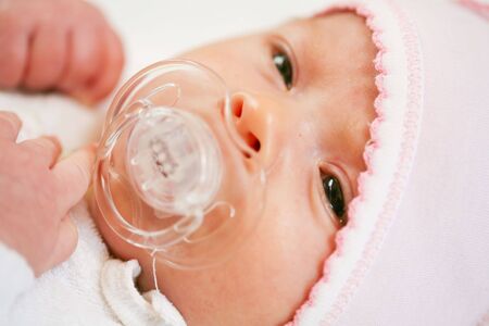 adorable baby with pacifier