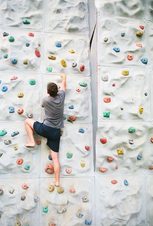 man climbing a wallの写真素材