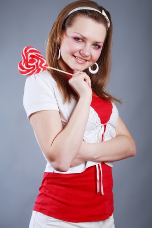 Portrait of beautiful girl with big lollipopの写真素材