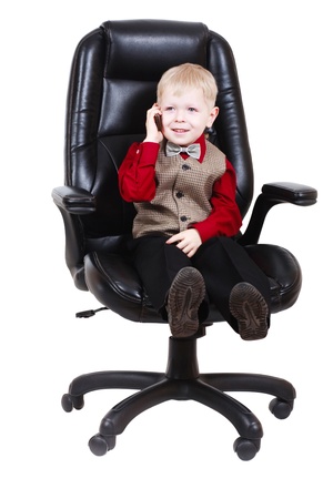 Child businessman boss calling by phoneの写真素材