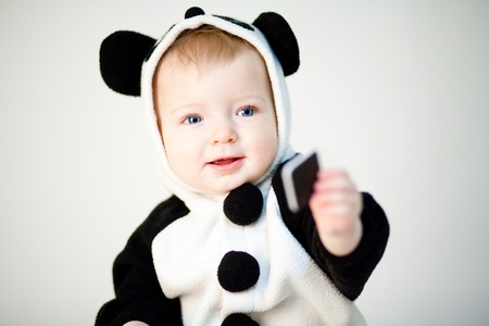 Baby in panda costumeの写真素材