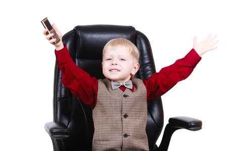 Child businessman boss calling by phoneの写真素材