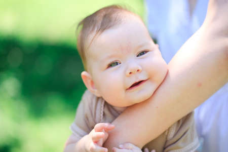Baby in mother's handの写真素材