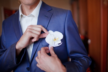 Groom getting flowersの写真素材