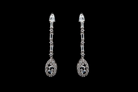 colored earrings on blackの写真素材