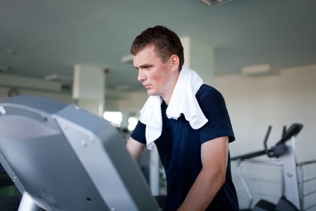 Healthy man a treadmill in a sport centerの写真素材