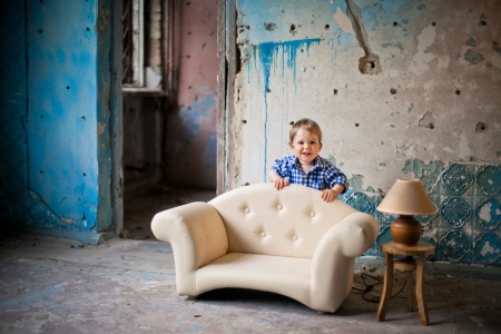 Adorable baby in the chair  Old house の写真素材