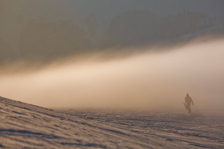 Snowboarder in high mountainsの写真素材