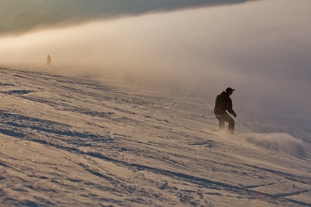 Snowboarder in high mountainsの写真素材