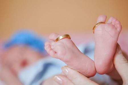 adorable newborn baby feetの写真素材