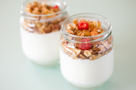 delicious and healthy yogurt and granola, fruits, nuts, grainsの写真素材