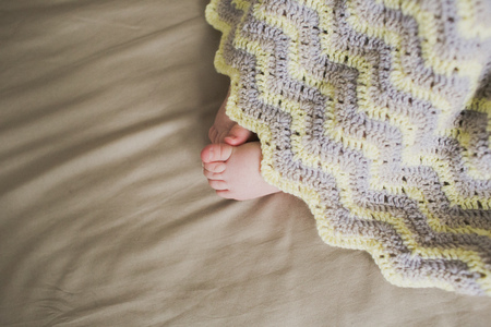 adorable newborn little baby feetの写真素材