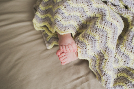 adorable newborn little baby feetの写真素材