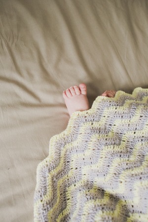 adorable newborn little baby feetの写真素材