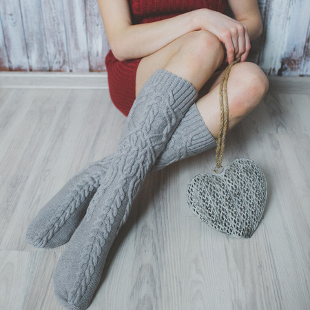 Cozy winter evening , warm woolen socksの写真素材