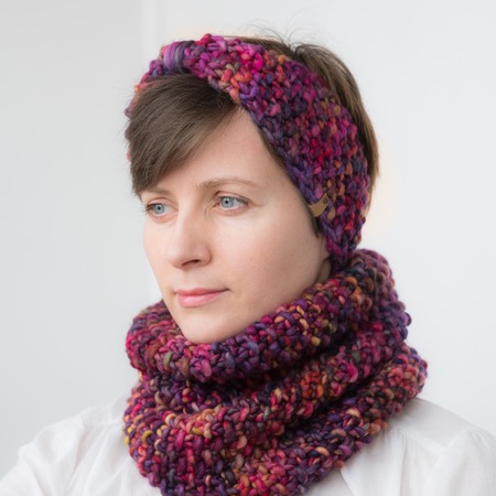 Beautiful young woman in hat and scarfの写真素材
