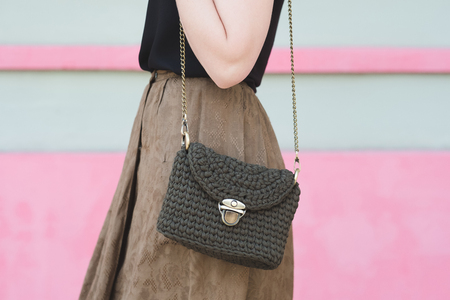 Close up photo of woman bag with fashionable woman. Elegant outfit. Female fashion conceptの写真素材