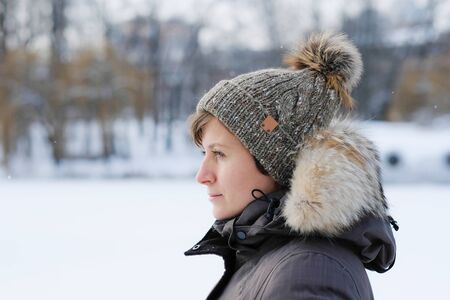 Pretty young woman wearing a knitting hatの写真素材