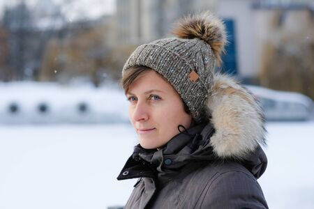 Pretty young woman wearing a knitting hatの写真素材