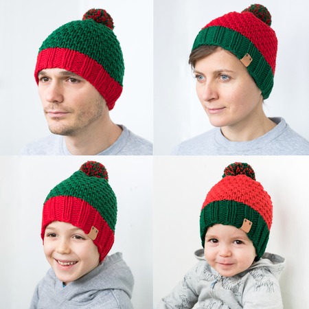 Family in knitted Elf red-green hatの写真素材