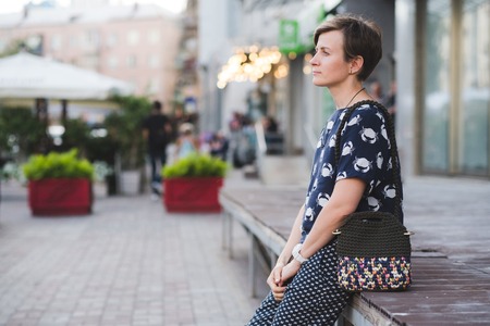 Close up photo of woman bag in hands of fashionable womanの写真素材