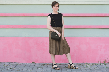 Outdoor full body portrait of young beautiful fashionable womanの写真素材
