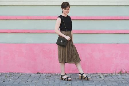 Outdoor full body portrait of young beautiful fashionable womanの写真素材