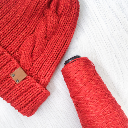 tangles with a knitting thread on a tableの写真素材