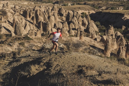 Sport running man in cross country trail runの写真素材
