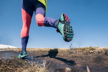 Sport running woman in cross country trail run. An active way of life, rear viewの写真素材