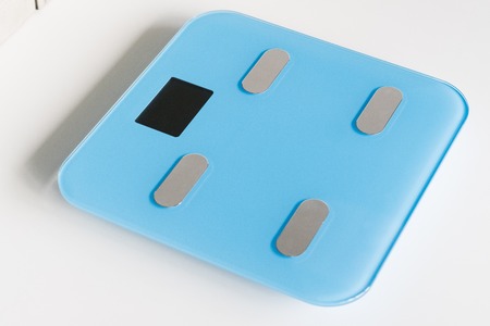 Kitchen scale over white backgroundの写真素材