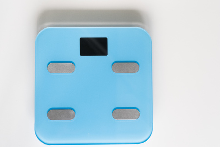 Kitchen scale over white backgroundの写真素材