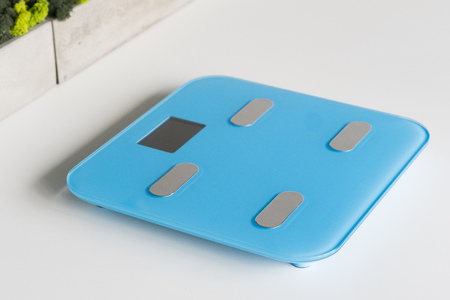 Kitchen scale over white backgroundの写真素材