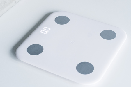 Kitchen scale over white backgroundの写真素材