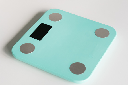 Kitchen scale over white backgroundの写真素材