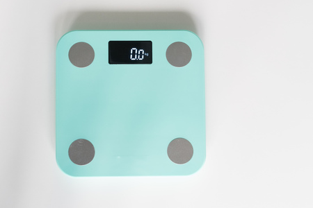 Kitchen scale over white backgroundの写真素材