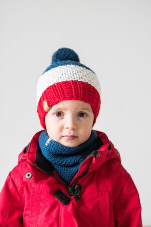 funny cute kid in knitted hatの写真素材