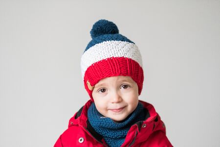 funny cute kid in knitted hatの写真素材
