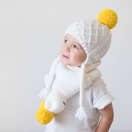 funny cute kid in knitted hatの写真素材
